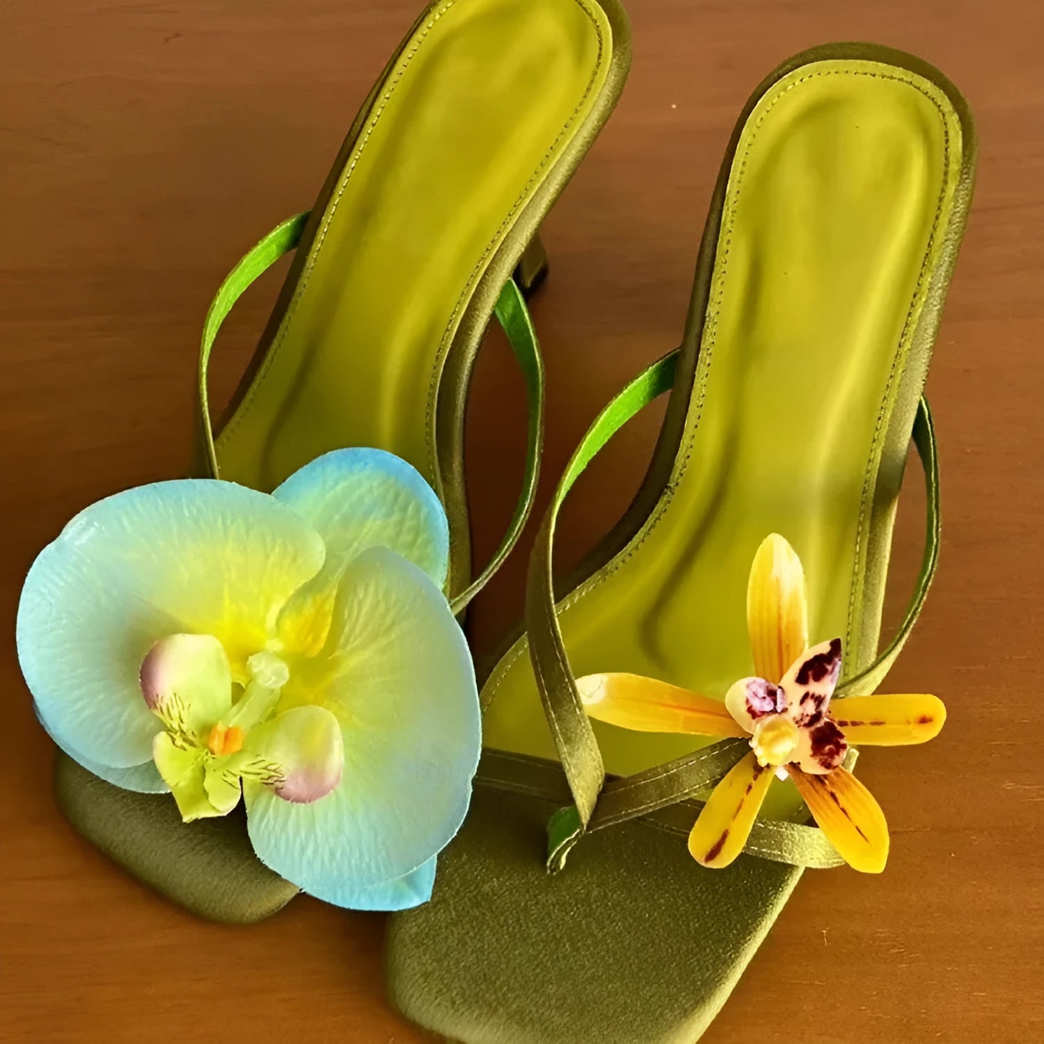 Women's handmade asymmetric flower high-heel sandals in black with a square toe and calf leather upper.