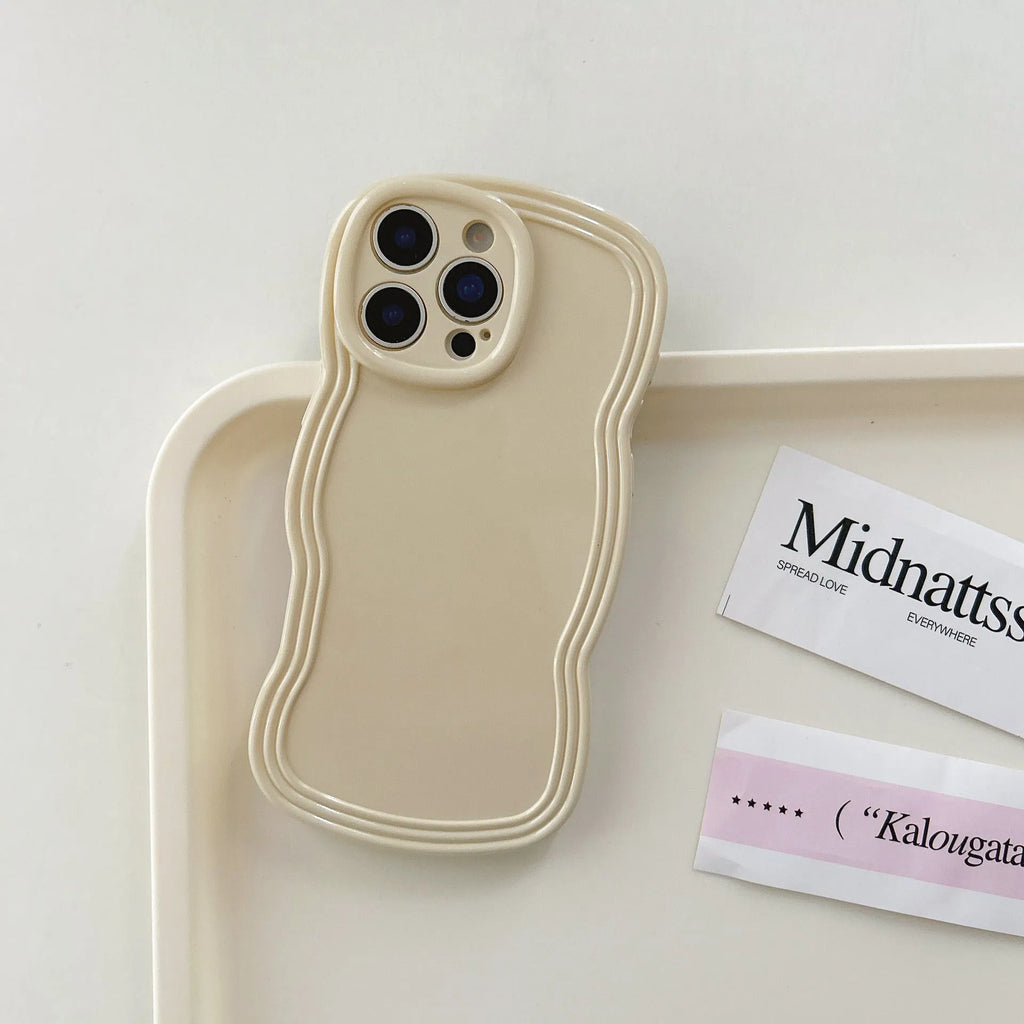 Cream coloured wave texture mobile phone case for iPhone on wooden surface