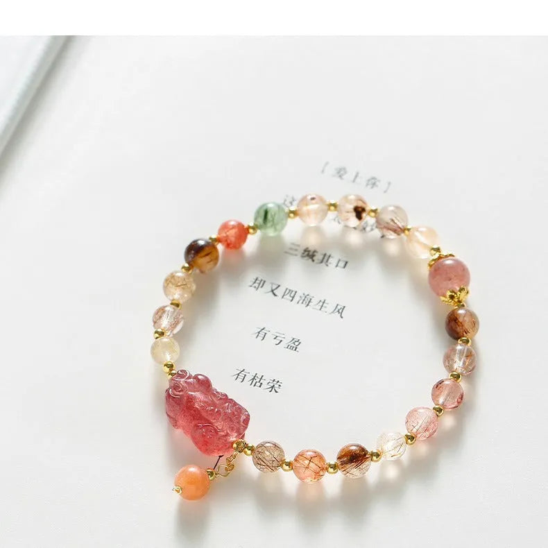 Chinese-style strawberry quartz crystal bracelet with copper construction, Pixiu charm, and pearl accents in dopamine crystal colour