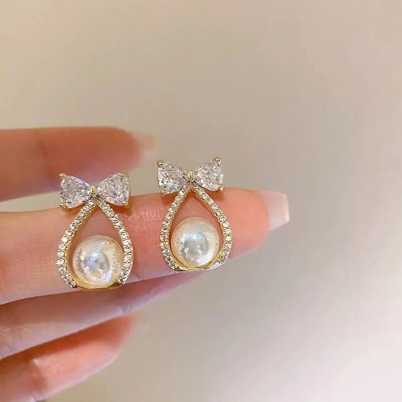 Women's alloy bow earrings with electroplating finish in colour as shown in main image
