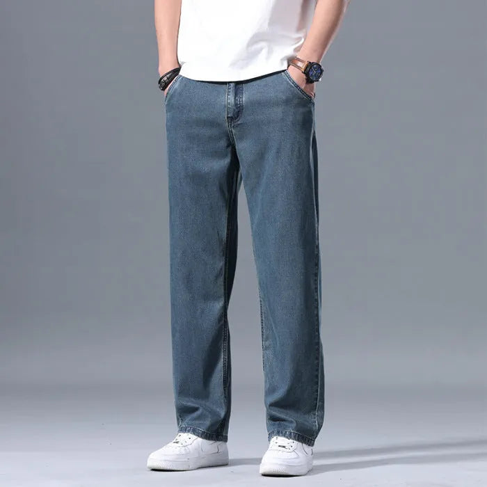 Men's loose fit straight-leg Lyocell jeans in a blue colour with a zip fly.