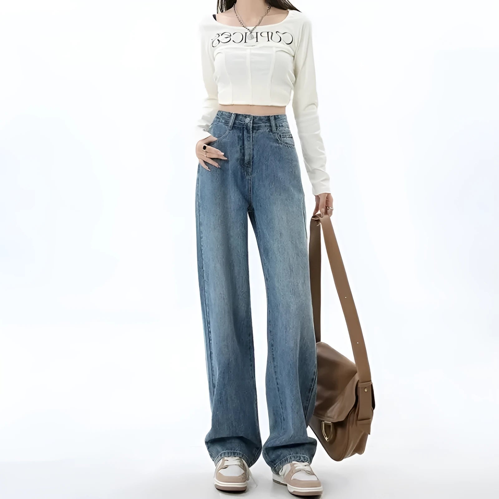 Woman wearing high-waisted retro blue wide-leg denim jeans with a straight cut.