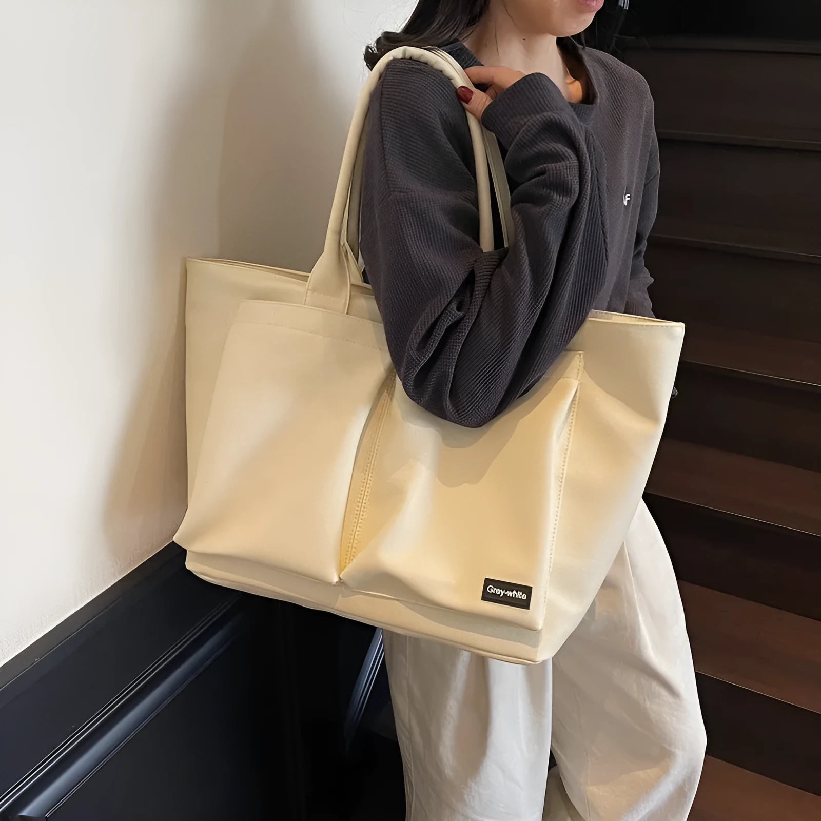 Lightweight expandable PU shoulder bag shown in solid green colour with ventilation panel