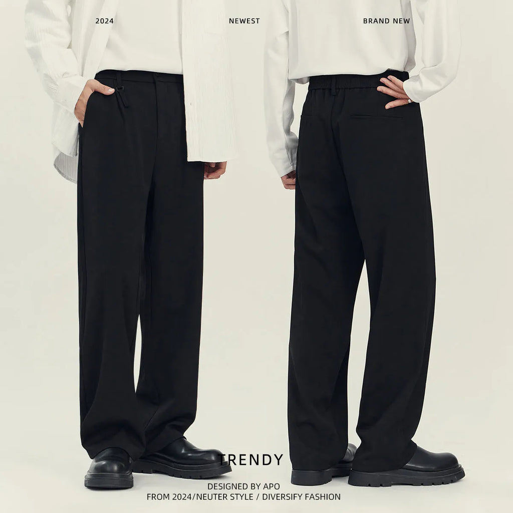 Black and grey loose straight-leg business casual trousers on a hanger, showing draping fit.