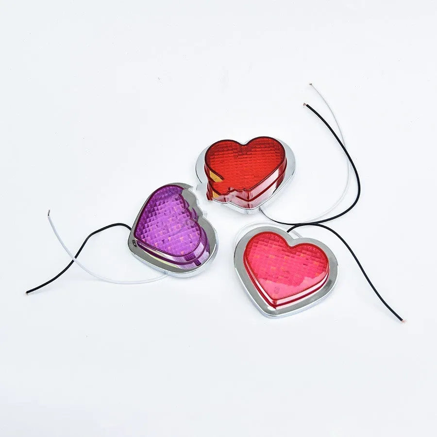 Heart-shaped red LED automotive sidelight mounted on car fender