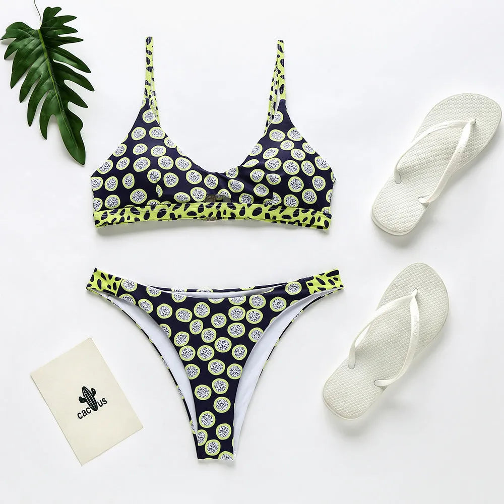 Women's black and white polka dot and red and white stripe polyester bikini set for swimming.