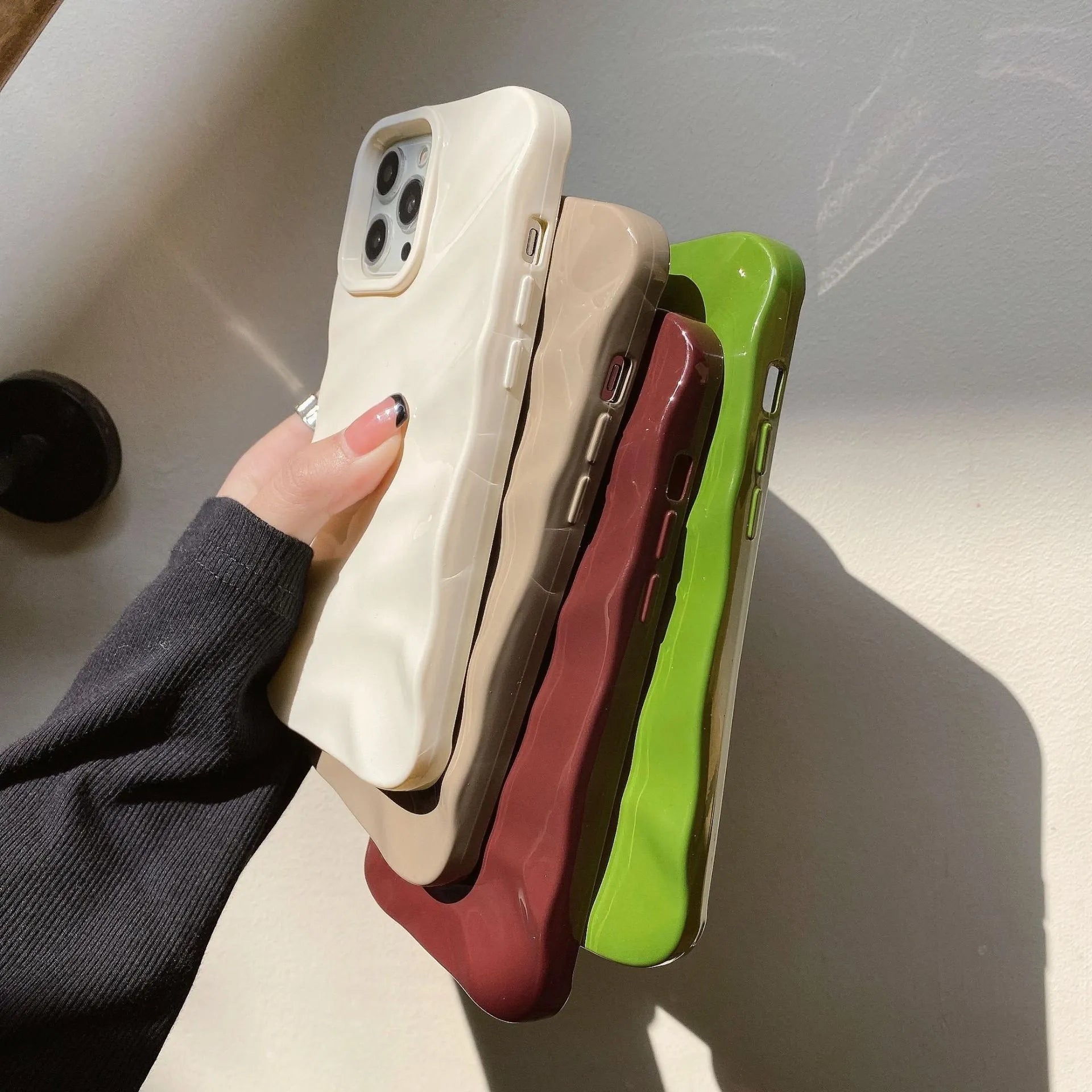 Soft textured wave pleated TPU phone case for Apple iPhone 17 models in a burgundy colour