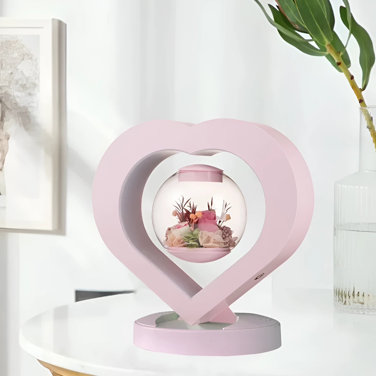 Pink preserved rose ornament in a decorative style, shown with optional base and bluetooth speaker features.