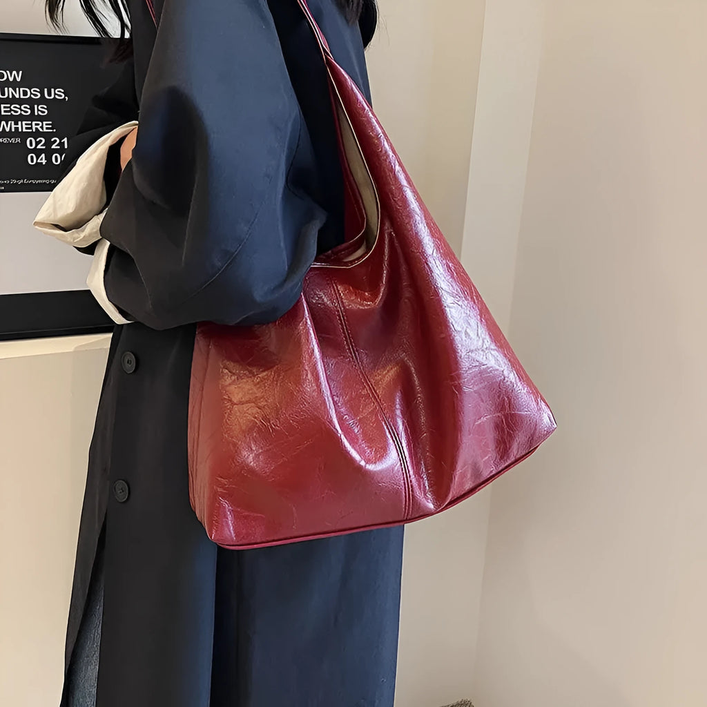 Soft leather large capacity casual shoulder bag with zip closure in multiple colour options.
