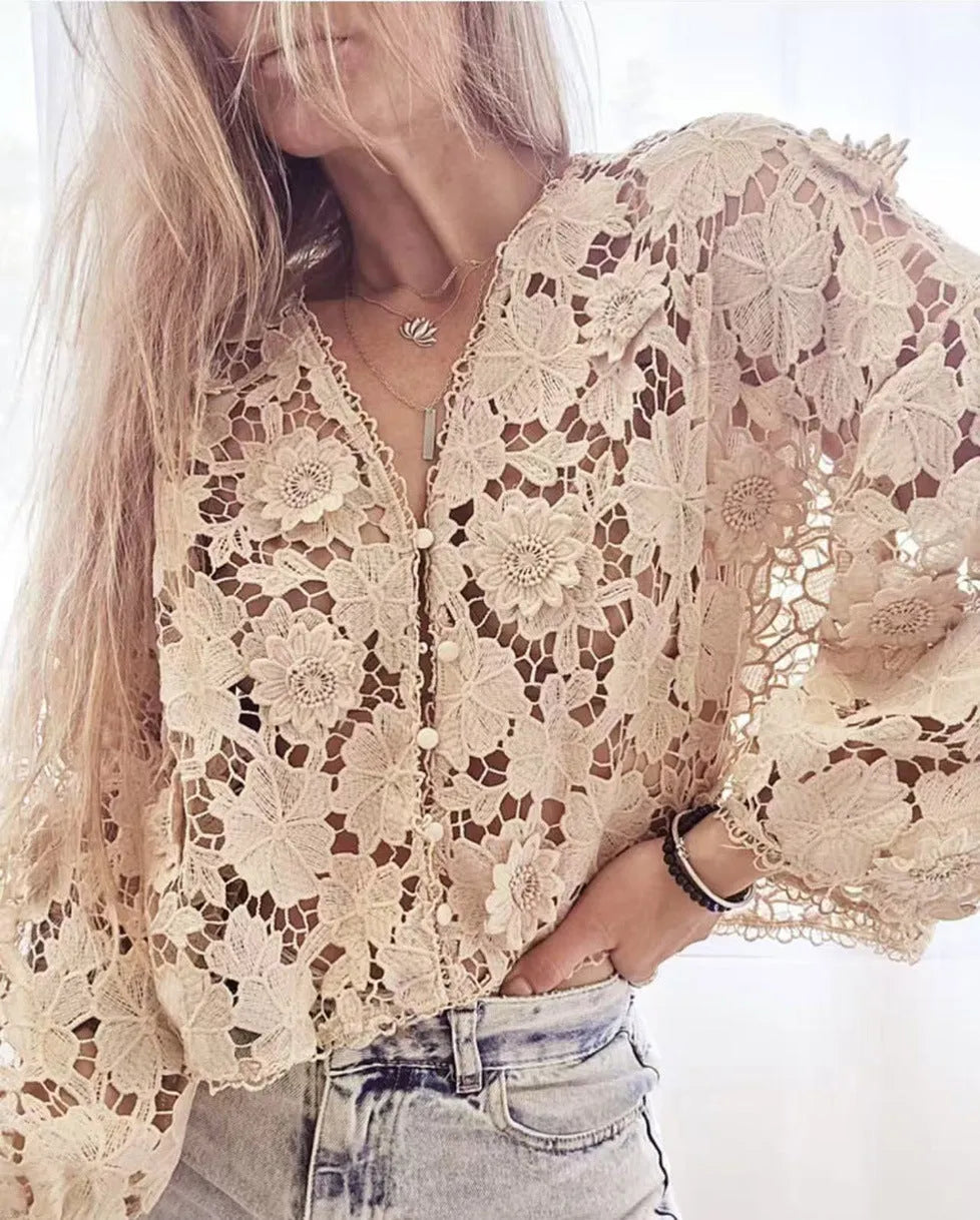 A women's loose black lace cardigan with a V-neck and three-dimensional floral decoration on the front.