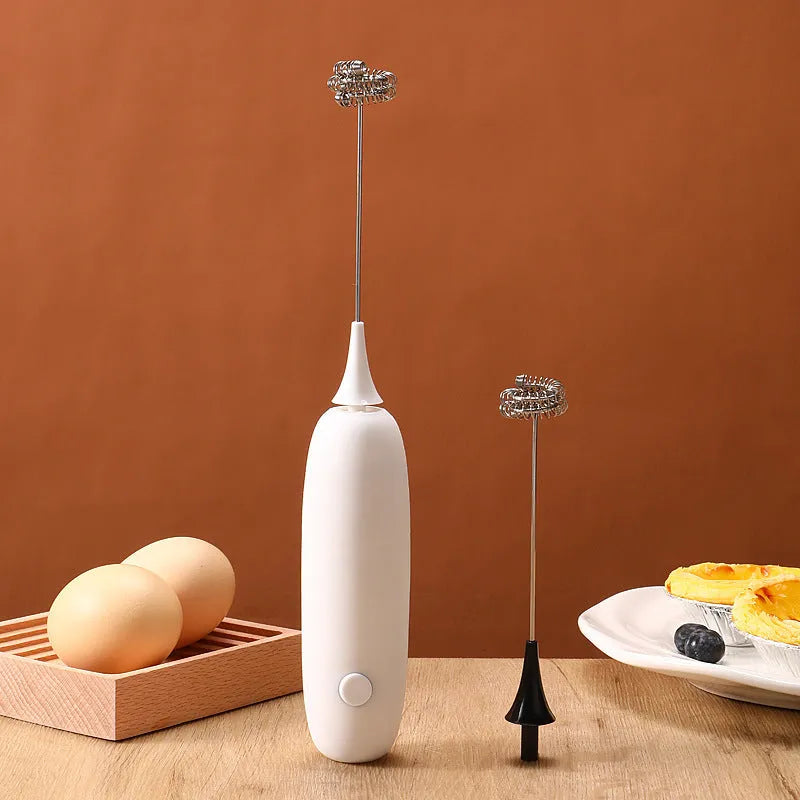 Black and white handheld electric milk frother and blender with modern design