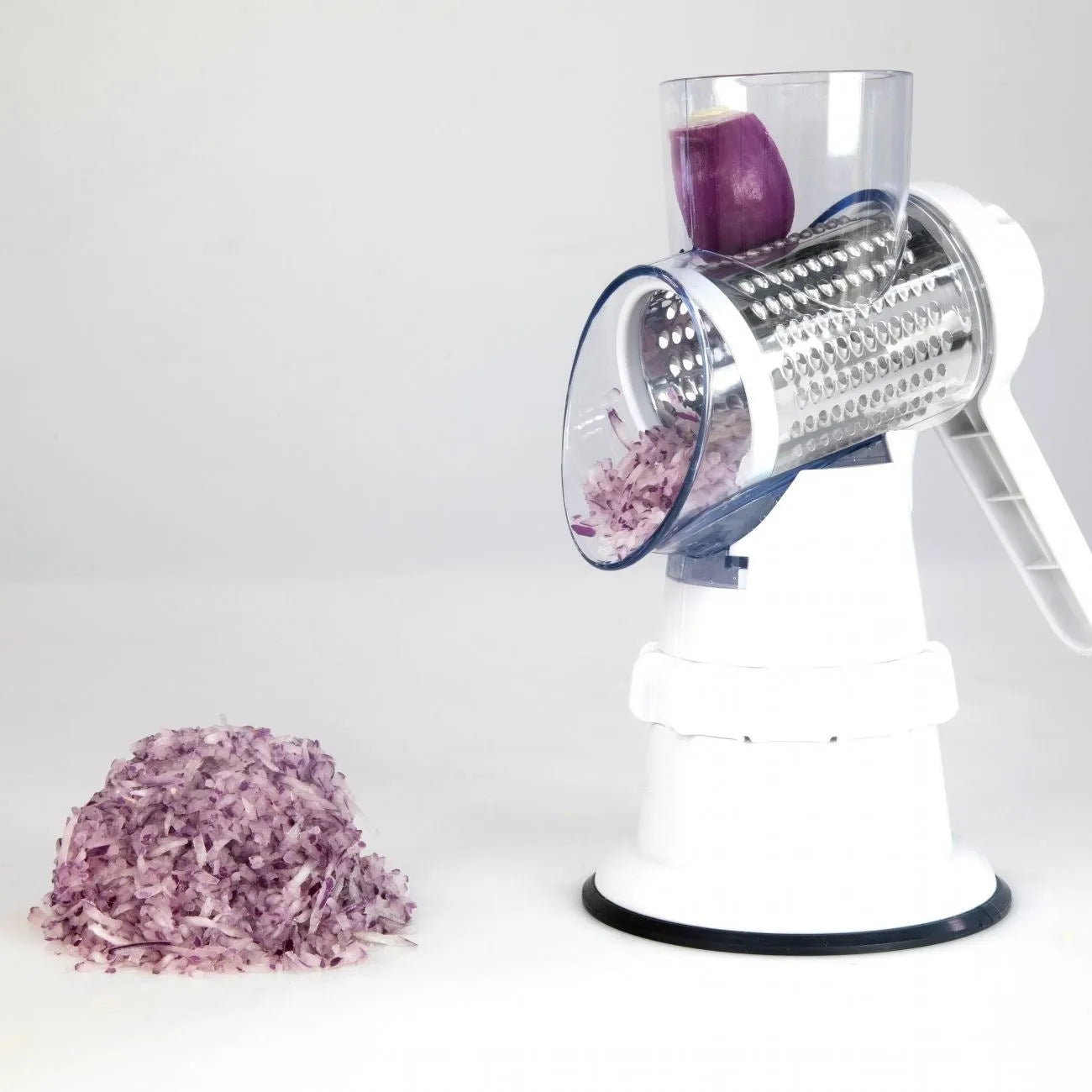 White plastic 3-in-1 manual vegetable slicer with suction feet and stainless steel blades