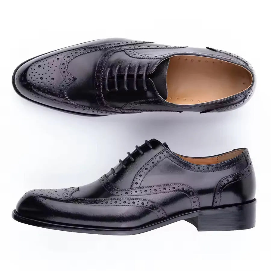Men's purple leather Oxford dress shoes with hand-carved detailing and pointed toe on a rubber sole.