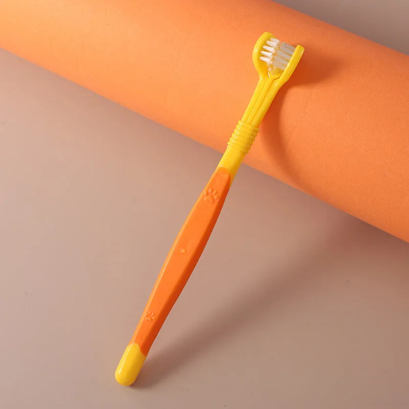 Pet toothbrush with angled handle and soft nylon bristles in multiple colour options for dog and cat dental care