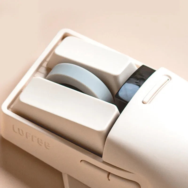 Tofu-coloured three-mode wireless mouse with ergonomic design on a desk.