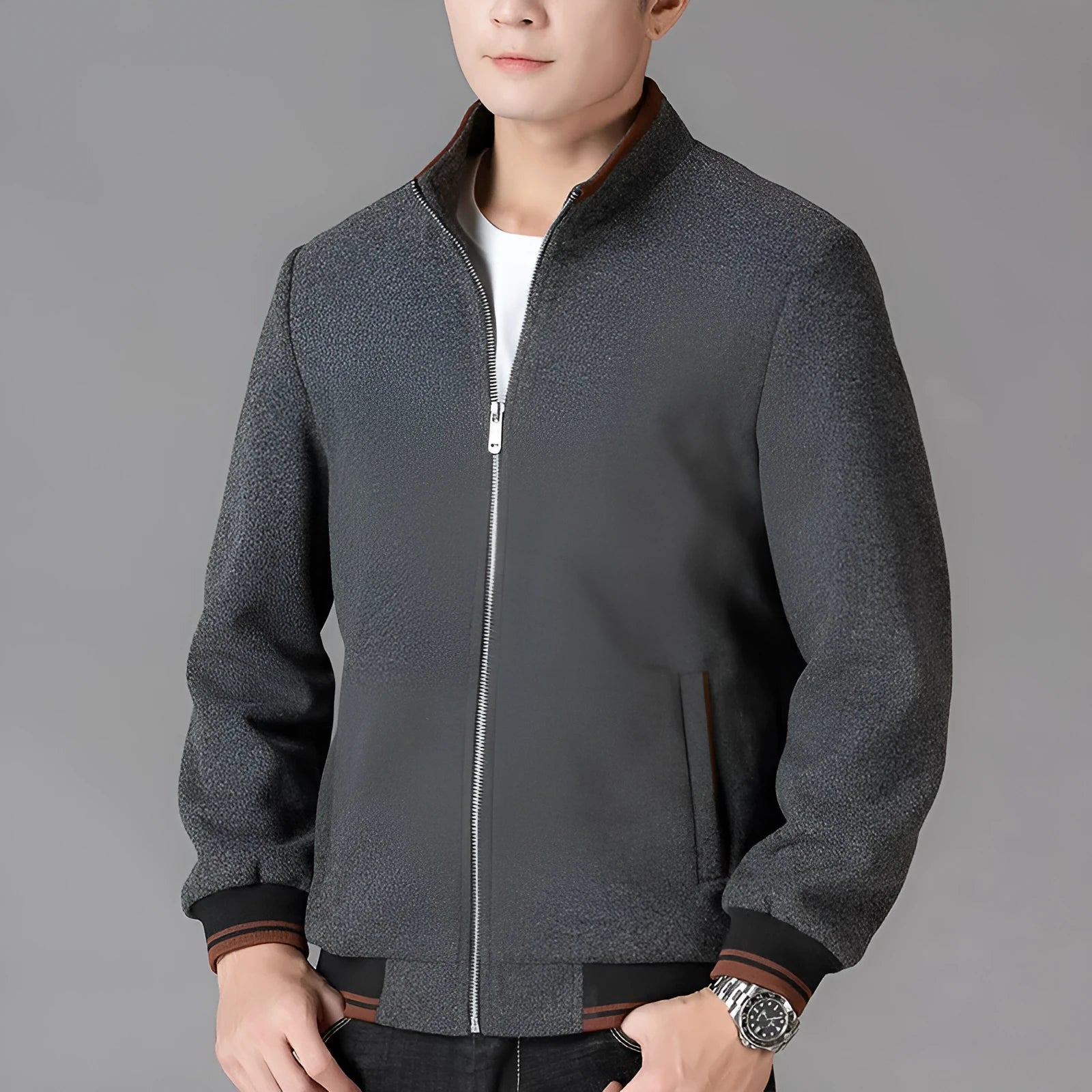 Men's grey polyester fleece sports coat with long sleeves and side pockets.