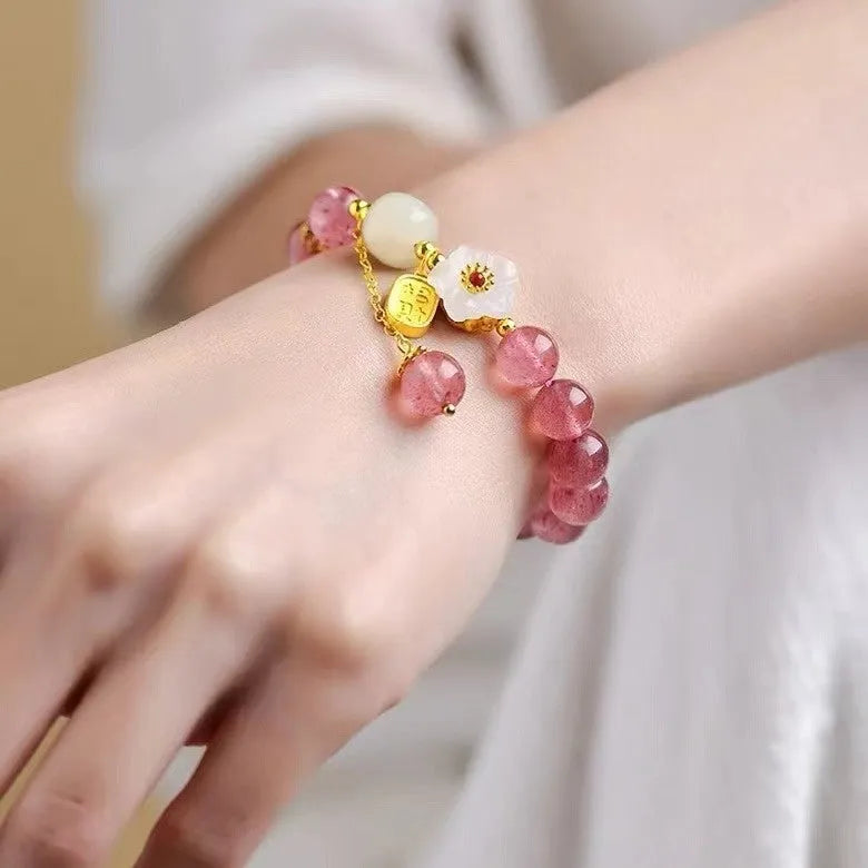 Handmade strawberry quartz crystal bracelet for women showing green strawberry quartz moon design.