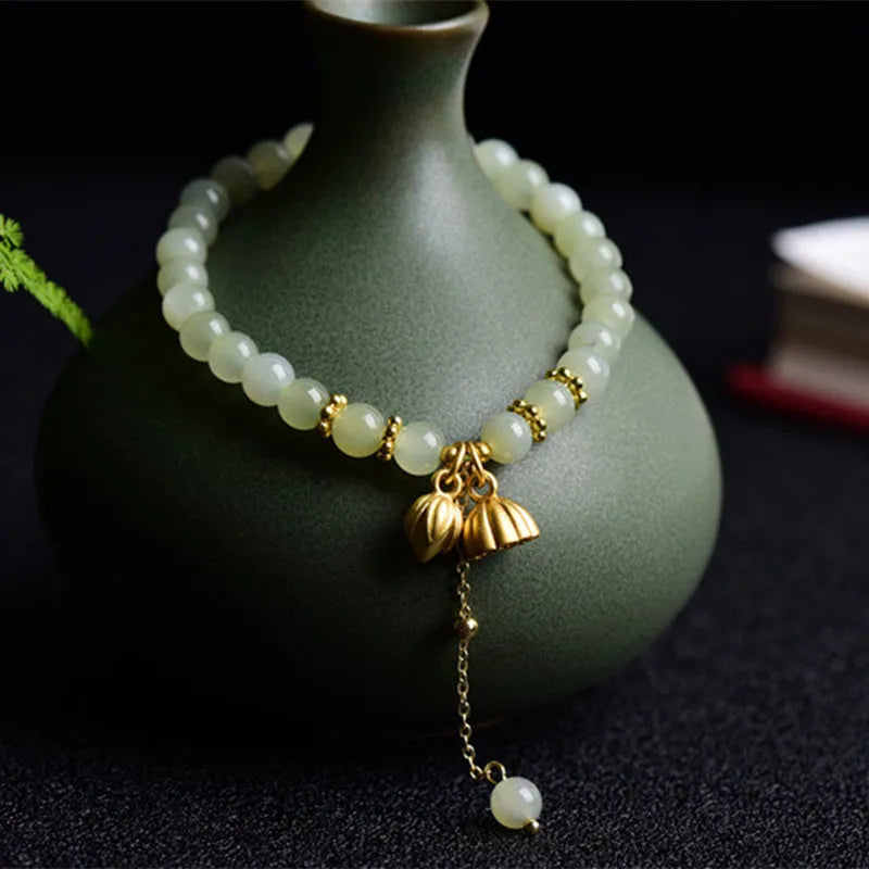 Two Shihuan natural Hetian jade bracelet with 6mm beads showing lotus and fu character designs