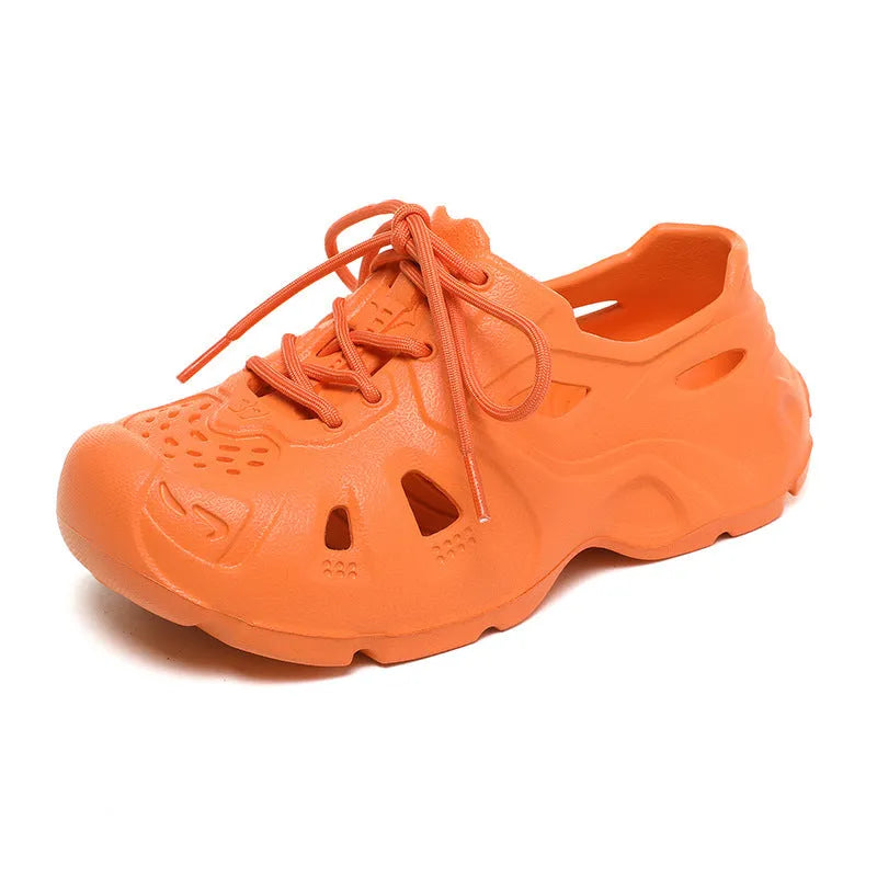 Pair of bright green EVA sandals with a thick, moulded sole and simple strap design.