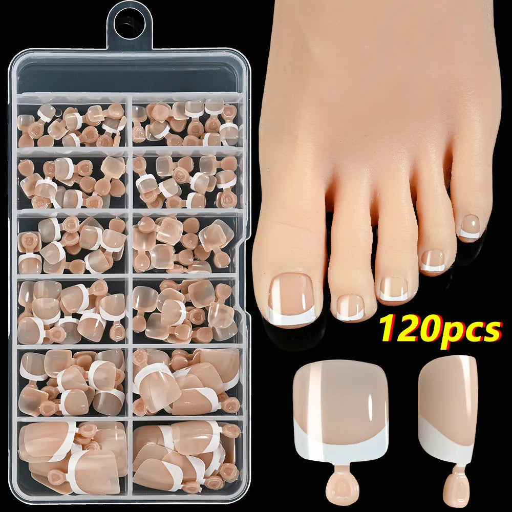 120 piece boxed set of full square short artificial toenails with French white edge design on nude base