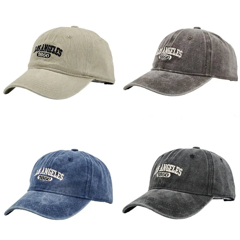Retro beige peaked cap with embroidered letters, showing distressed fabric texture and adjustable strap.