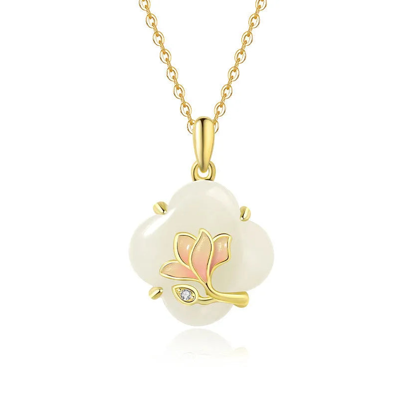 Magnolia flower Hetian jade and sterling silver necklace, bracelet, and earrings set on a white background.