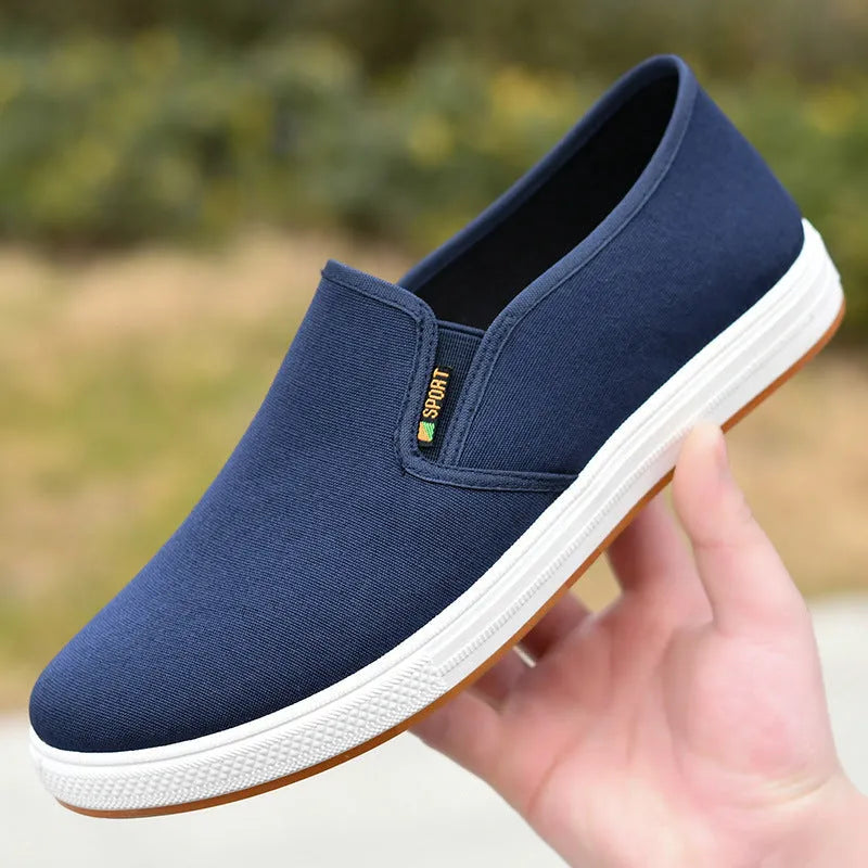 Men's low-top canvas trainers with slip-on design and round toe shape in black colour