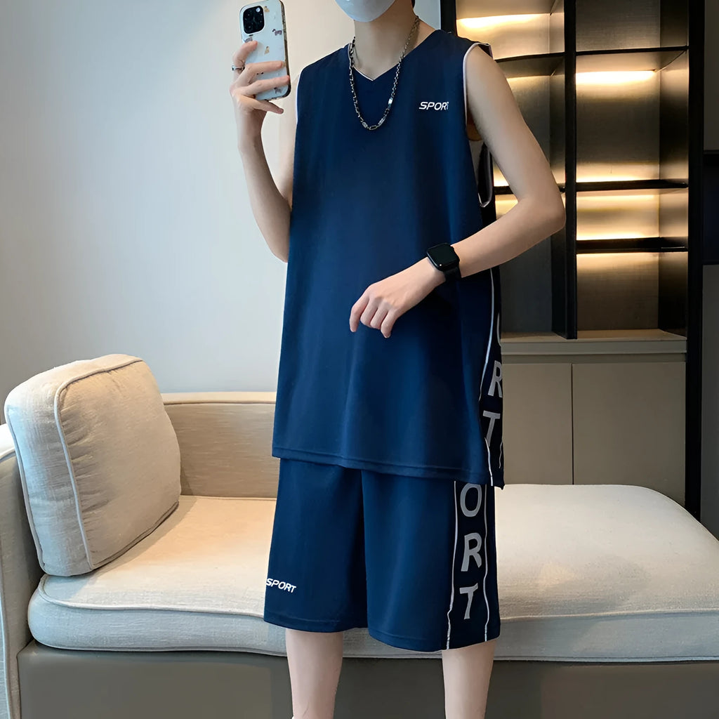 Light grey polyester basketball vest and shorts sports suit laid flat