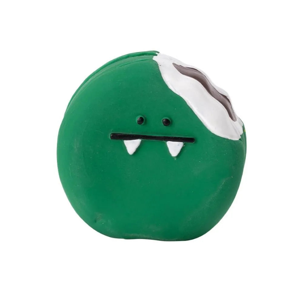 Green and yellow latex dog chew toy shaped like cartoon egg bread with a squeaker.