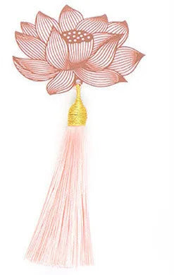 Detailed brass bookmark with hollow maple leaf pendant and rose gold tassel on a book page.