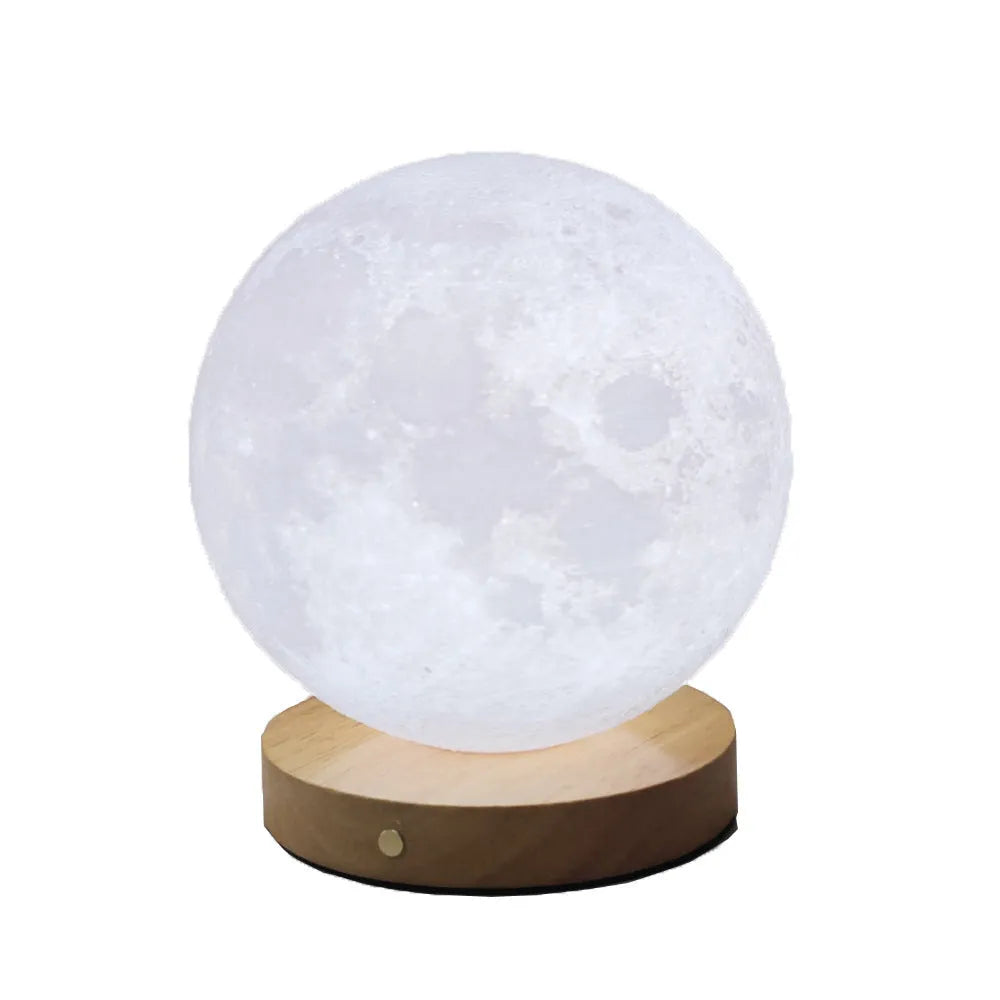 Rotating sleeping moon night lamp with wooden base showing three colour settings