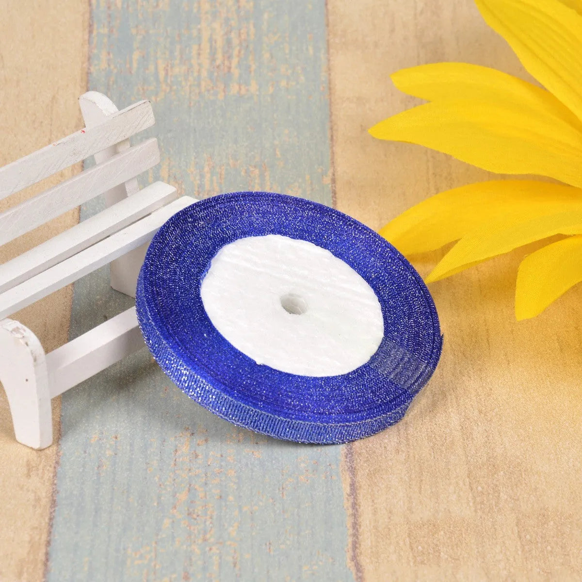 Colourful green onion pattern polyester ribbon spool with metallic gold or silver wire detailing.