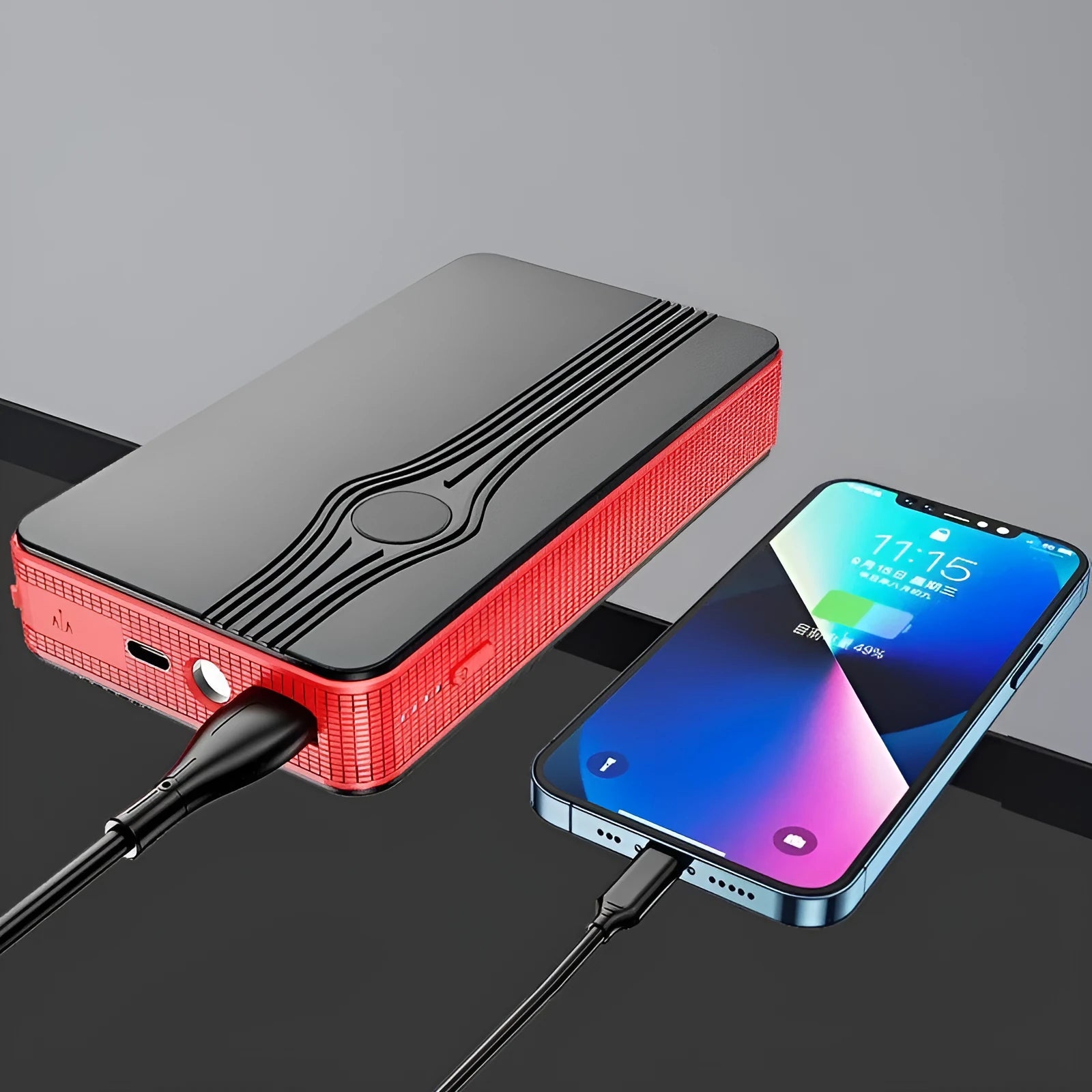Compact red K4-E car jump starter and power bank with USB port and display.