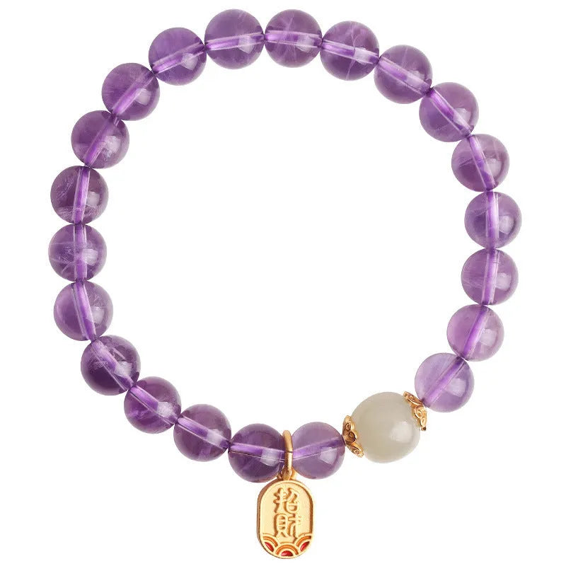 Close-up of a women's amethyst bracelet with 8mm geometric crystal beads on a wrist.