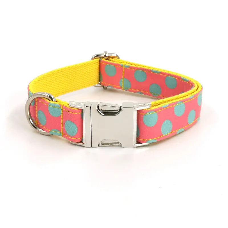 Yellow polka dot dog collar with attached lead rope and fabric bow decoration
