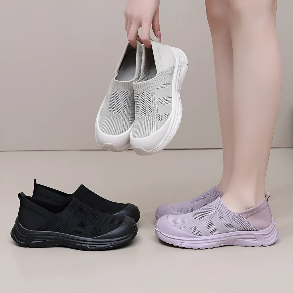 Women's black slip-on shoes with round toe design and soft PVC sole for casual wear