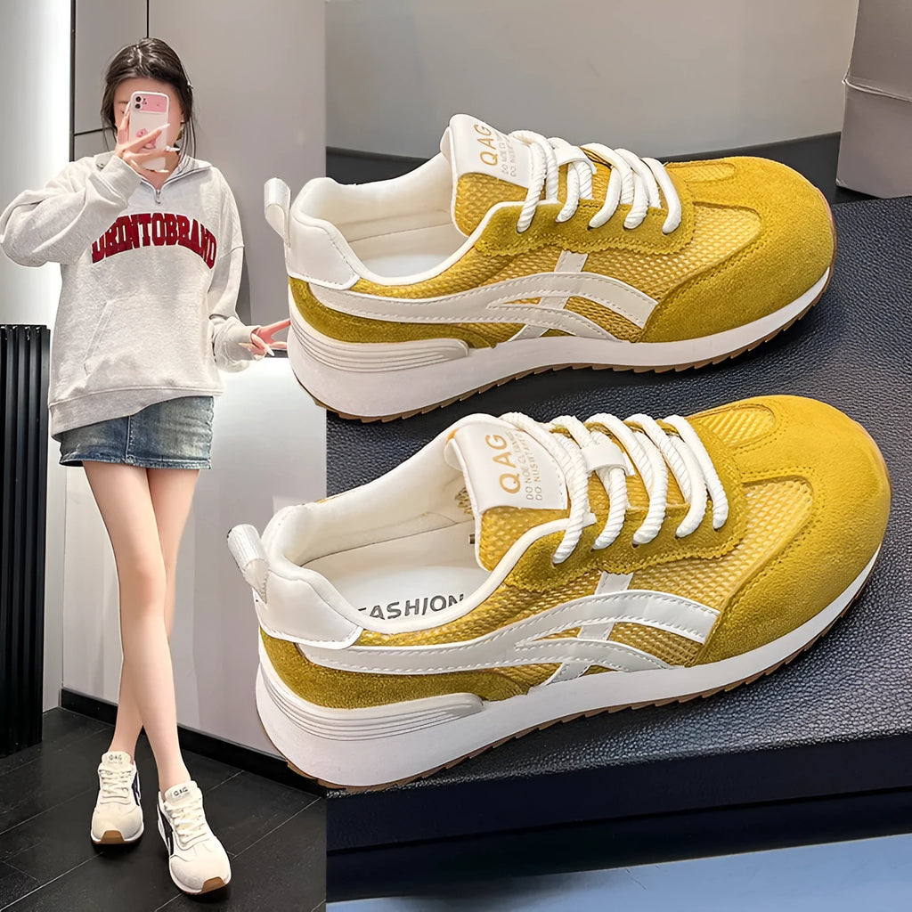 Women's white casual lace-up sneaker with non-slip sole on neutral background