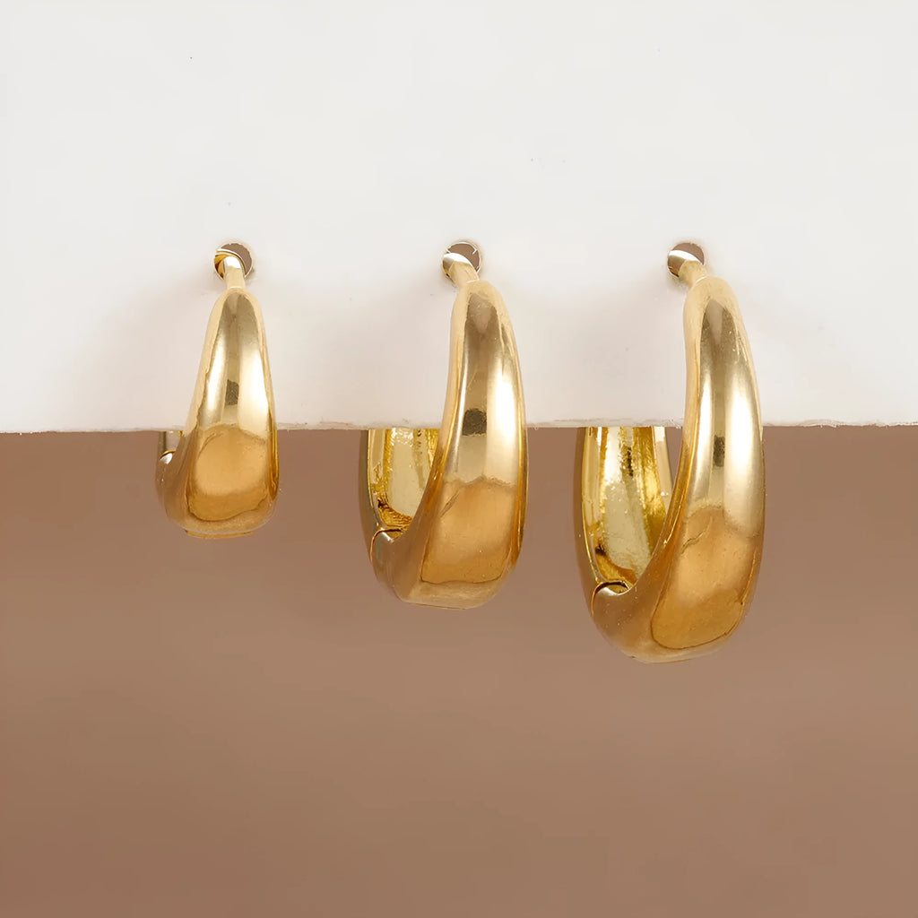 Geometric copper earring set of 3 glossy gold electroplated round shape earrings on display