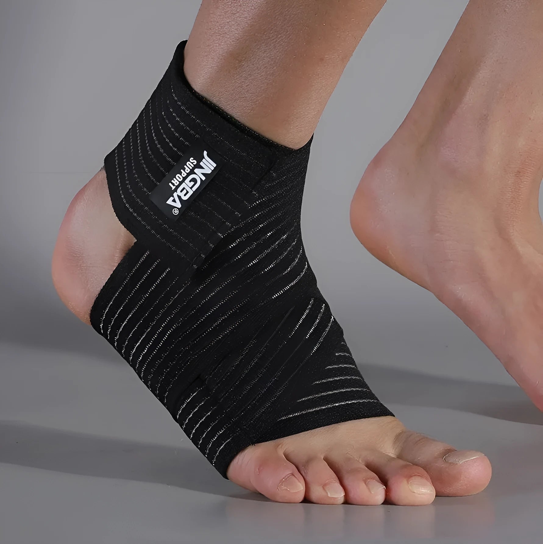 Black adjustable elastic sports bandage for ankle support during running and basketball.