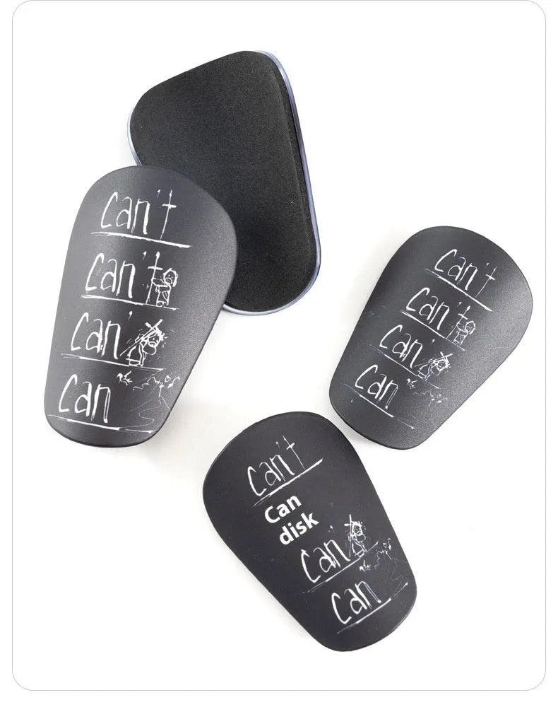 Football training shin guards in PU material showing black, blue, white, and white-black colour options