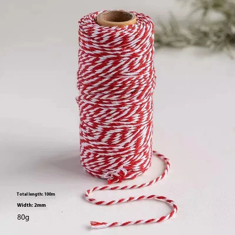 Red and white 2mm cotton thread cord tube on white background, 100 metres length