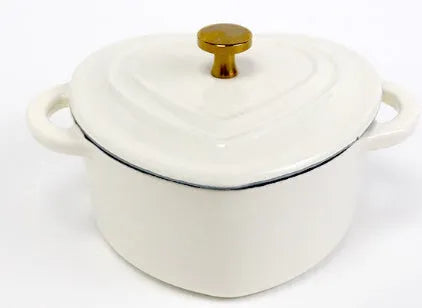 Heart-shaped cast iron enamel stewing pot with lid on stovetop, 11cm diameter