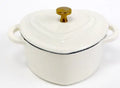 Heart-shaped cast iron enamel stewing pot with lid on stovetop, 11cm diameter