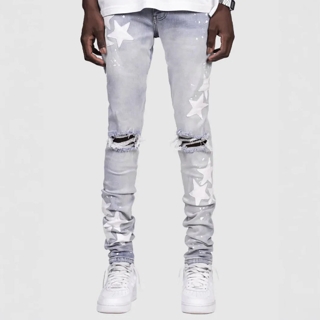 Men's slim stretch blue jeans with embroidery detail on denim fabric.