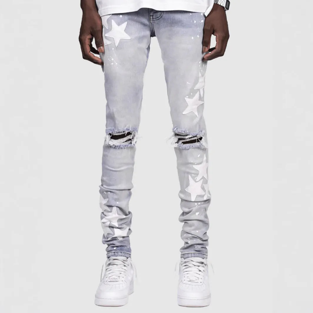Men's slim stretch blue jeans with embroidery detail on denim fabric.