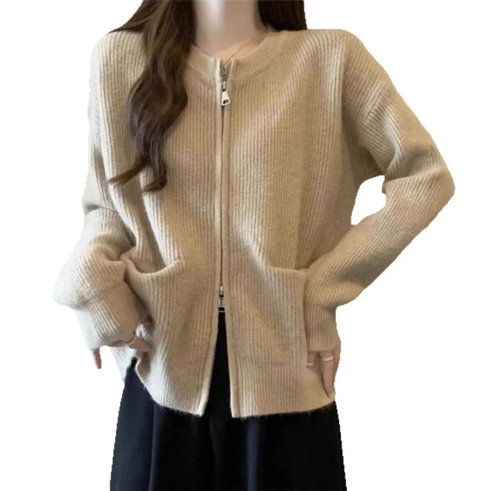 Soft beige viscose fibre sweater coat, a long-sleeve cardigan laid flat.