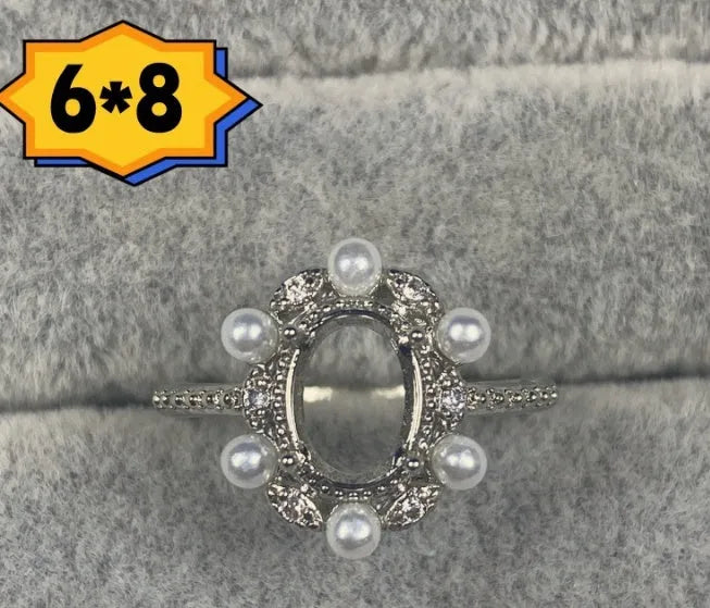 Oval denier open mouth ring with 6x8 main stone and five-pointed star design