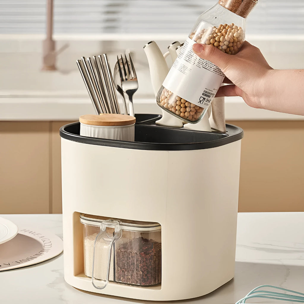 White rotating kitchen storage bucket with four compartments for cutlery and a separate spice box organiser.