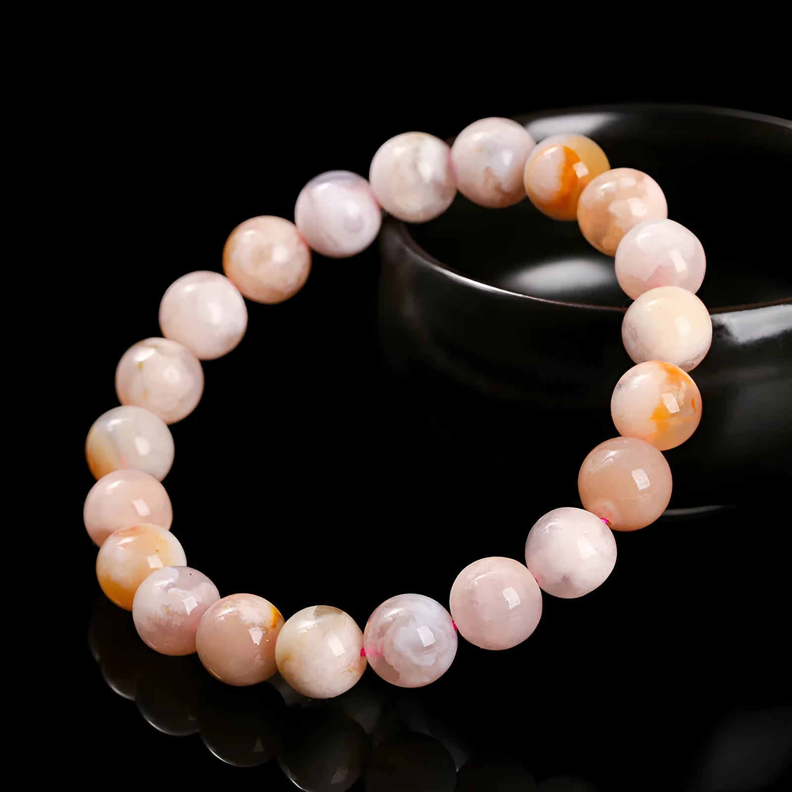 Natural cherry agate bracelet with round beads in a sweet style for women.