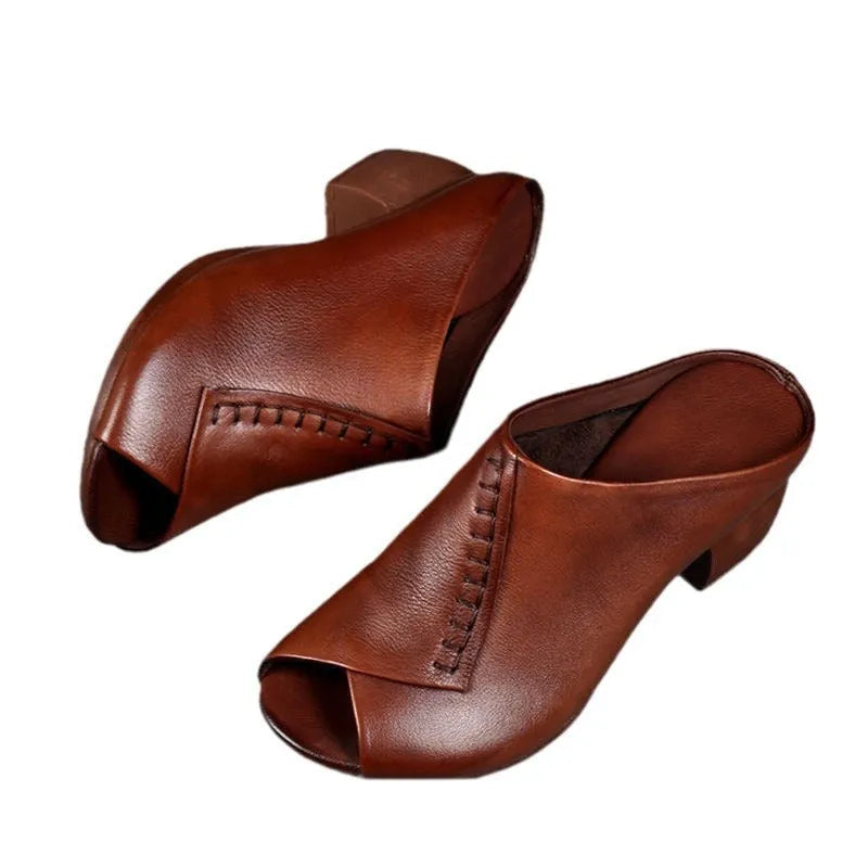 Women's black square heel peep-toe slippers with a fish-mouth scaffold design on a white background.